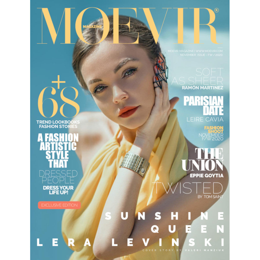 Cover of Moevir magazine featuring a person in a yellow outfit wearing black geometric rings, showcasing fashion trends and artistic style, with vibrant text.