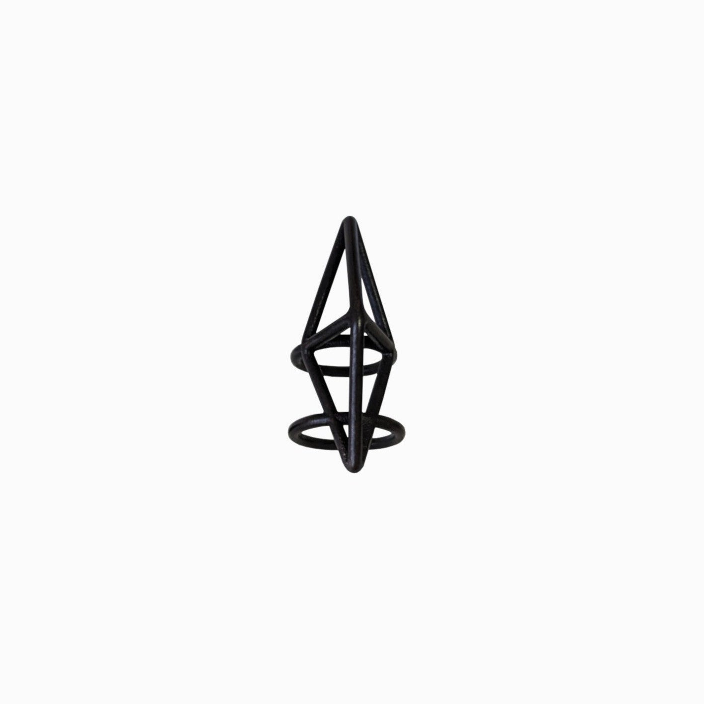 A black geometric ring resembling an abstract pyramid with circular bases, set against a plain white background.