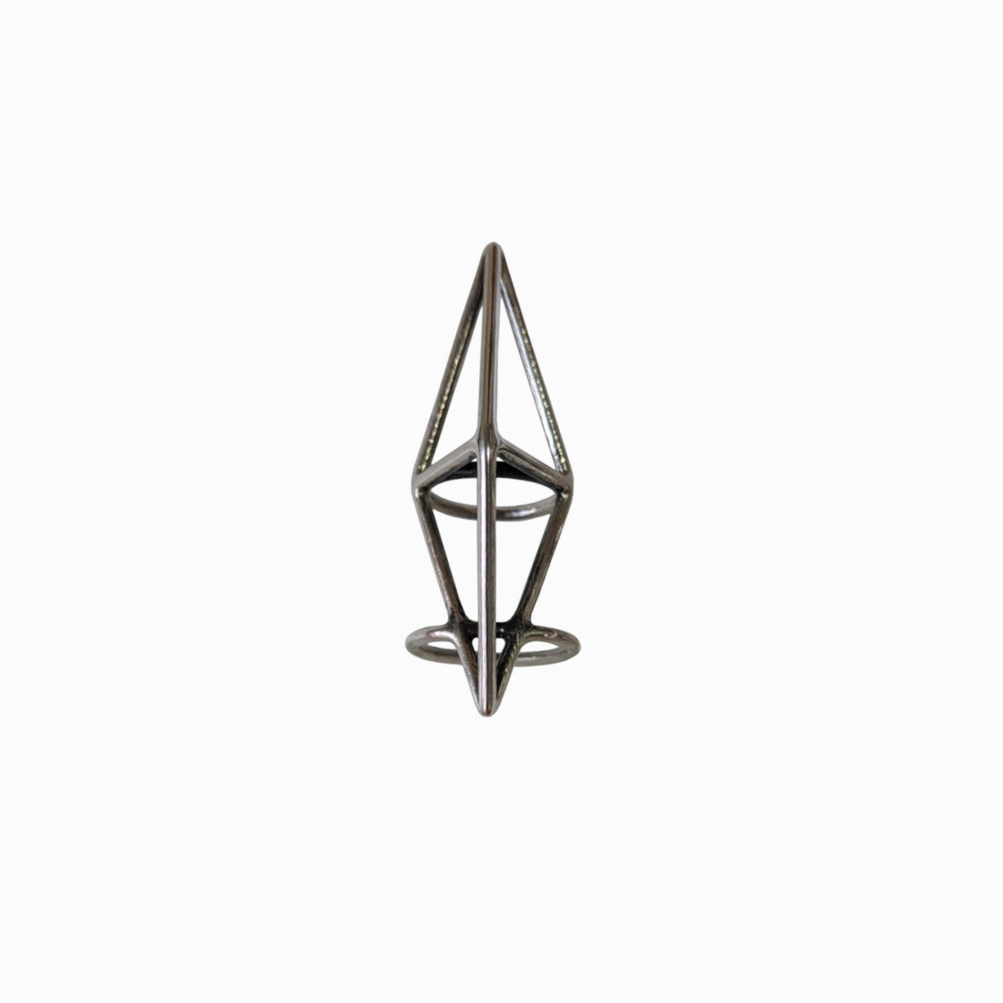 A geometric metal ring featuring a minimalist design with triangular and circular elements on a plain white background.