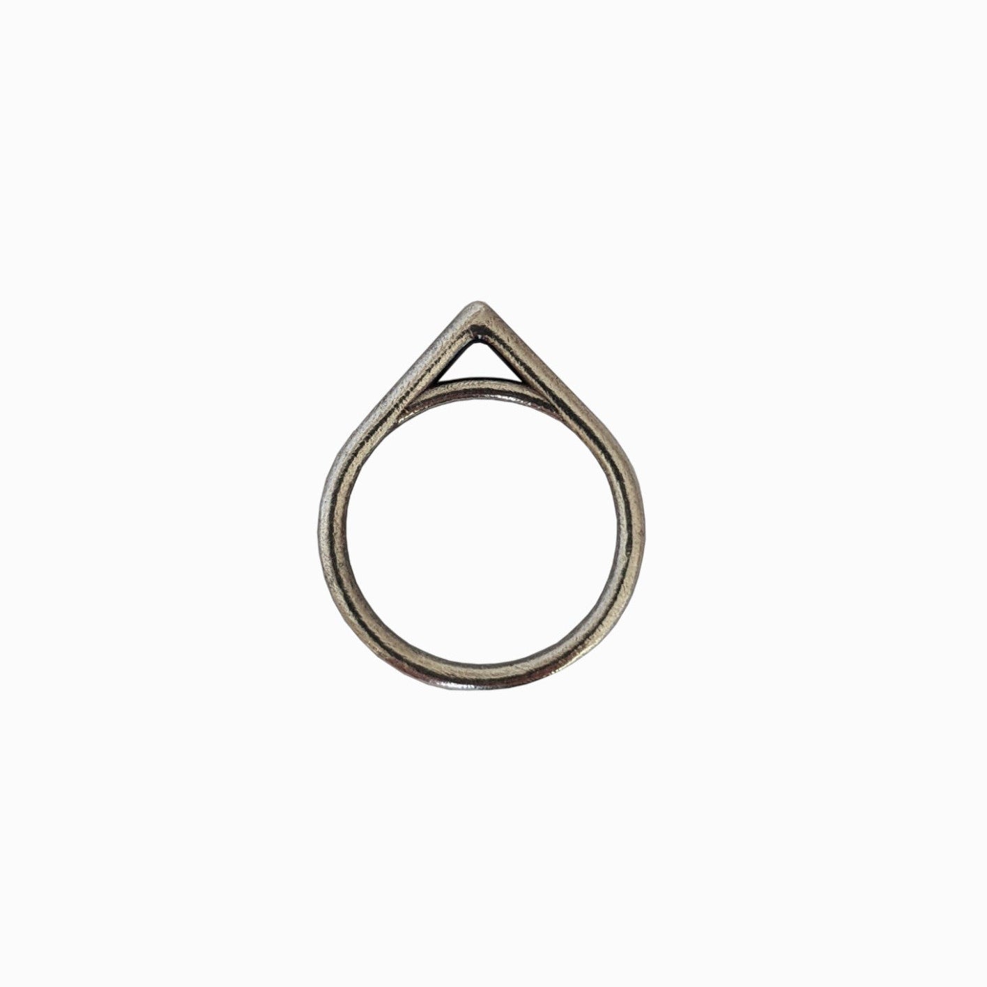 A minimalist silver ring with a teardrop shape and a triangular cutout at the top, displayed against a white background.