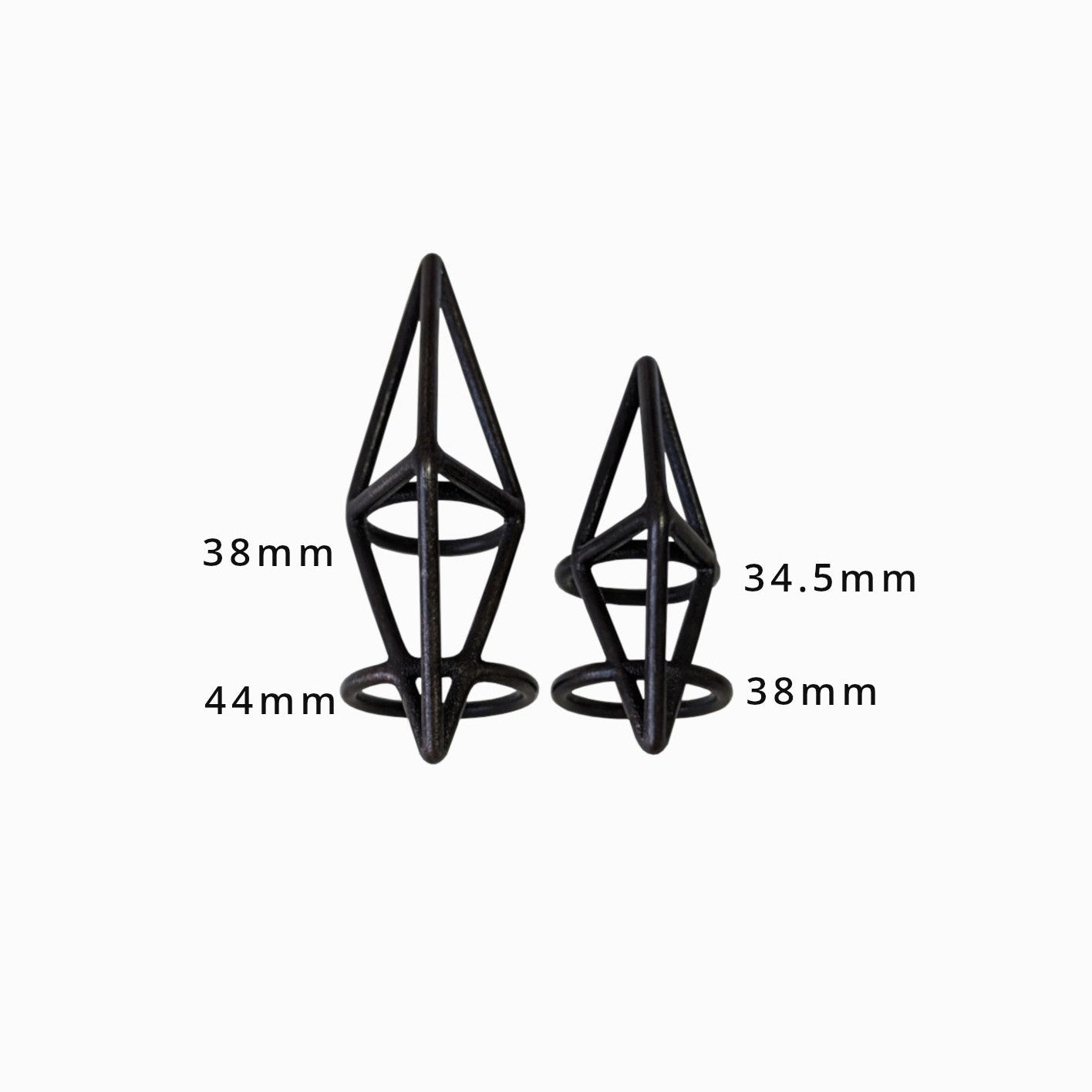 Two geometric black structures of varying heights, labeled 38mm, 44mm, and 34.5mm, displayed against a white background.
