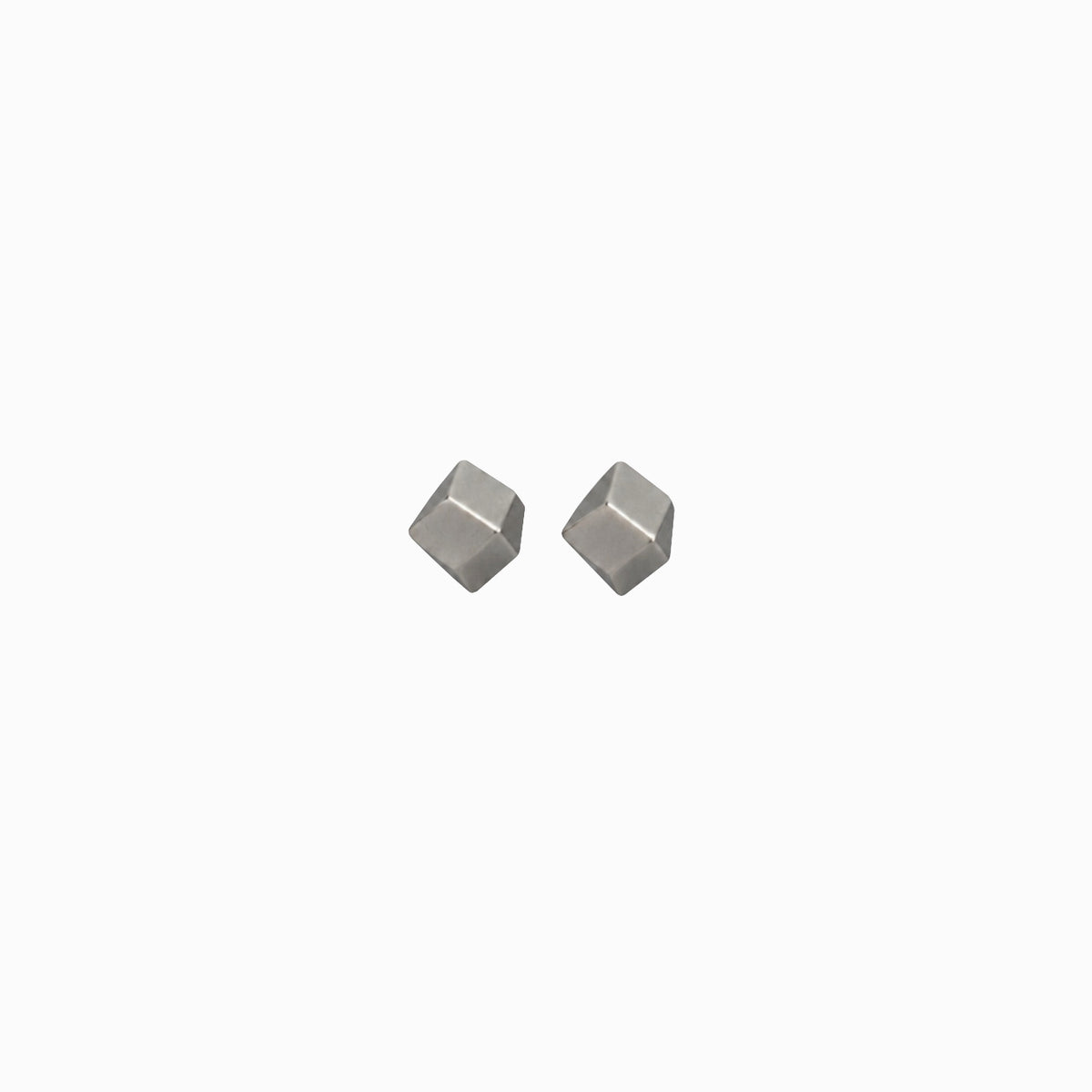 Two metallic geometric stud earrings on a white background