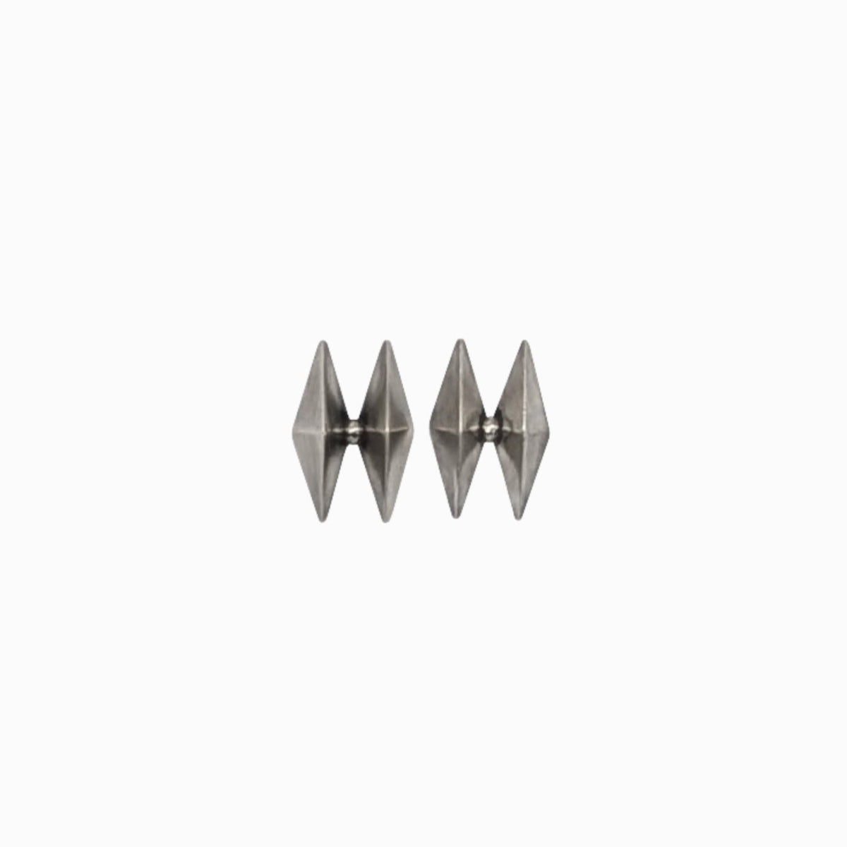 Three metallic silver pyramid-shaped earrings arranged side by side on a plain white background.