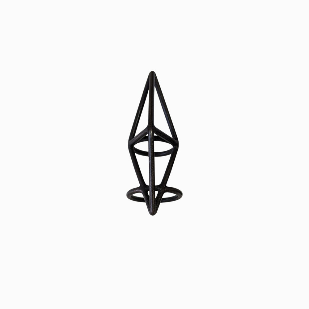 
                  
                    A black geometric ring resembling an abstract pyramid with circular bases, set against a plain white background.
                  
                