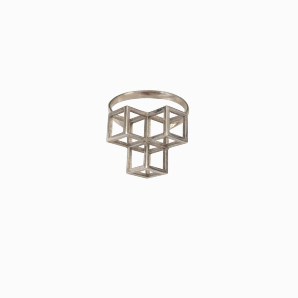 A modern, geometric silver ring featuring an intricate design of interlocking cubes.
