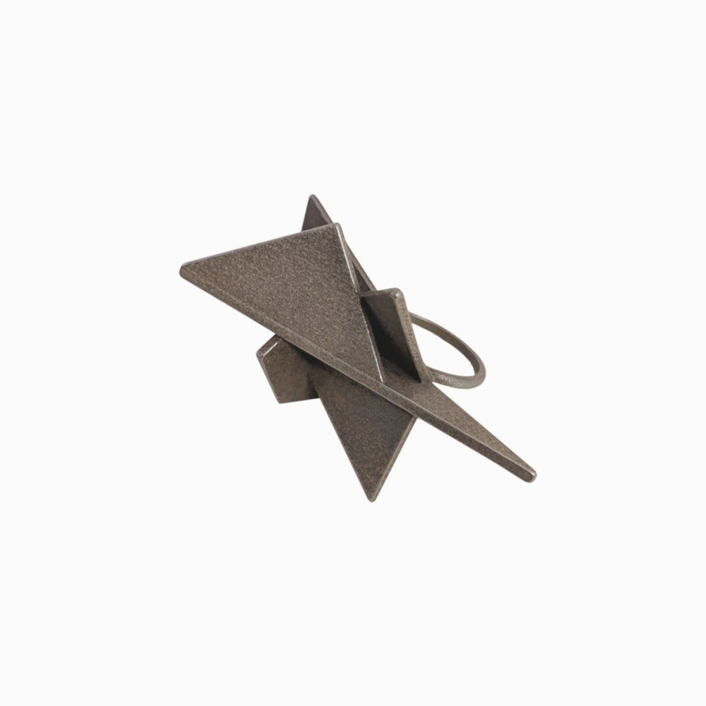Black angular ring featuring intersecting geometric shapes, showcasing a modern and minimalist design.