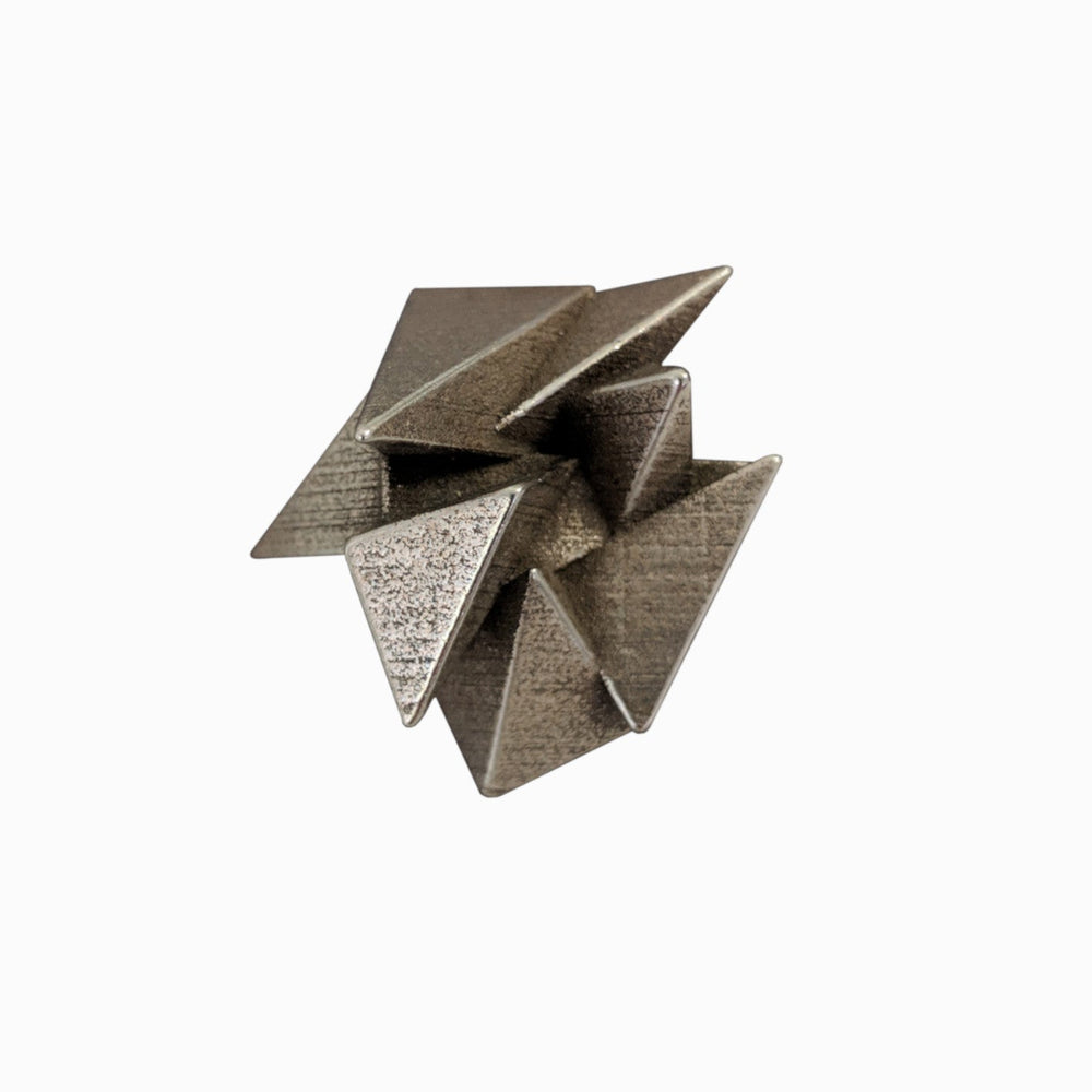 
                  
                    A metallic sculpture featuring interconnected triangular shapes, creating a dynamic, three-dimensional design with textured surfaces.
                  
                